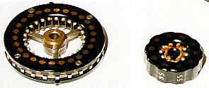 Photo of large rotor on left which 
is a cipher or control rotor and the rotor on right which is an index 
rotor.